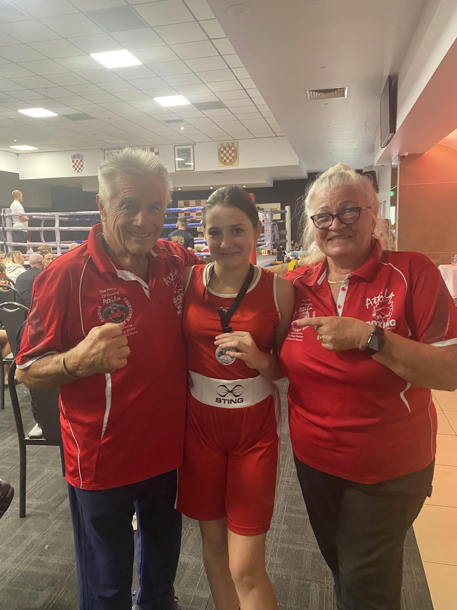 Female fighter and coaches Attila and Rita Kovacs